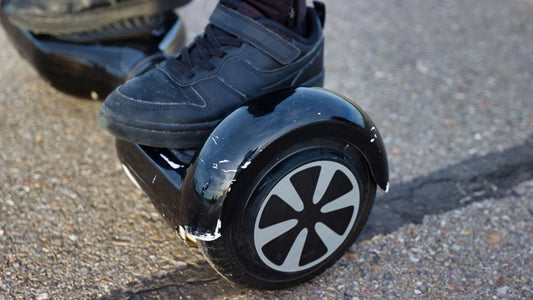 A man standing on a Rideo hoverboard