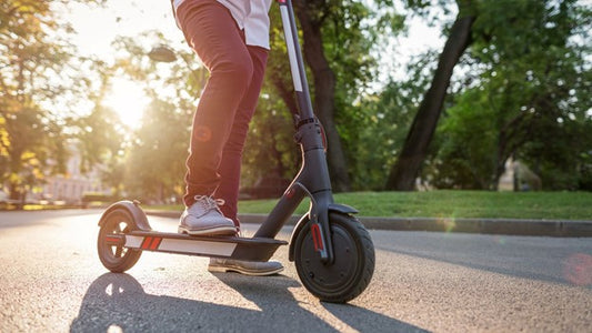 A person riding rideo E scooter