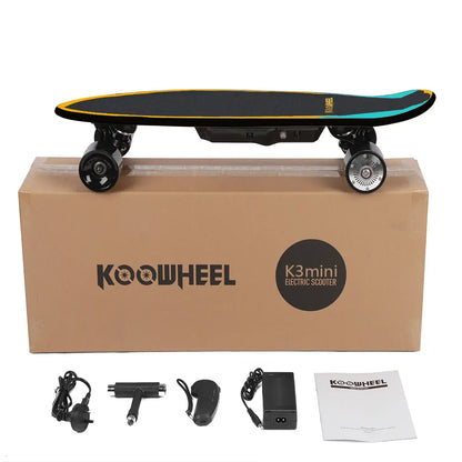 Boxed Koowheel electric skateboard package with accessories visible around the box.