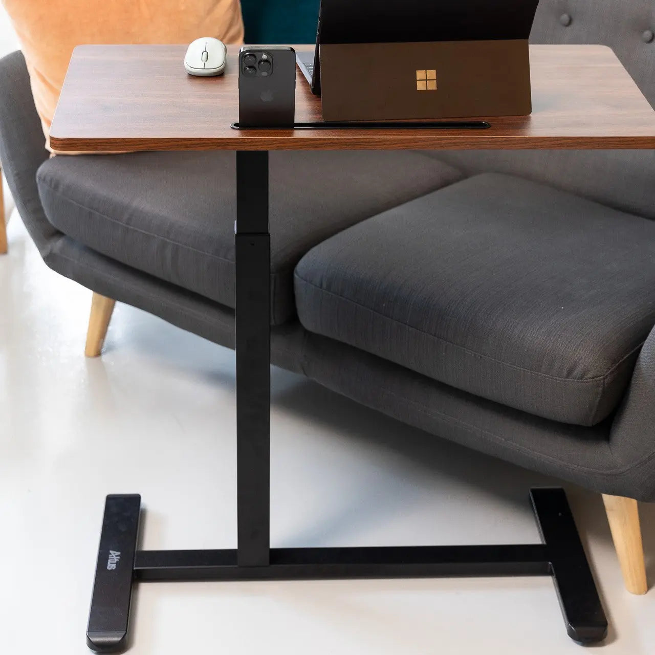 Full view of a mobile standing desk showcasing a spacious wooden top and sturdy black frame, suitable for various workspace environments.