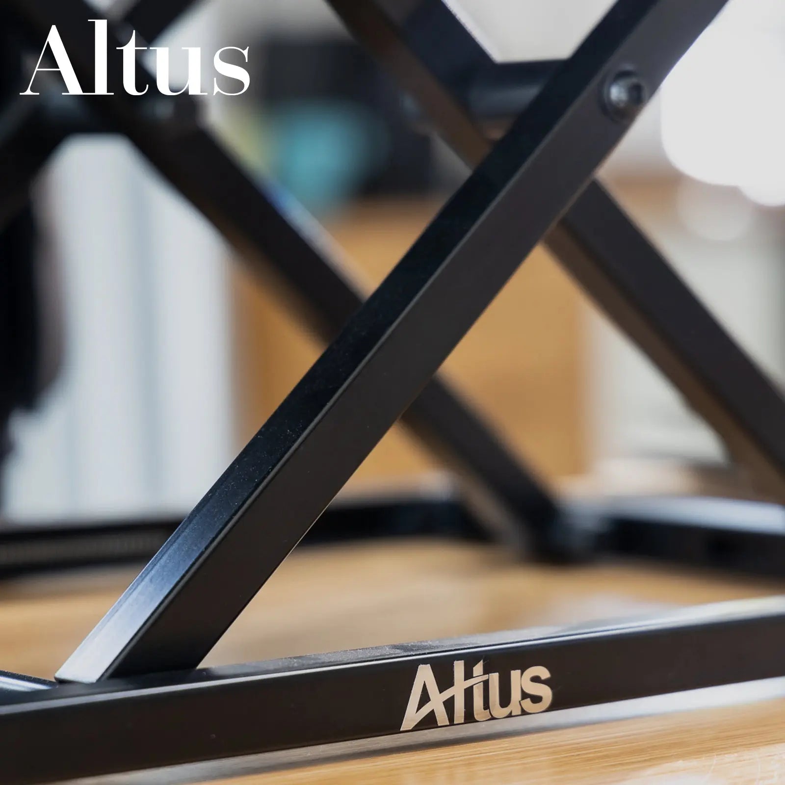 Close-up of the side mechanism of a black adjustable standing desk showing detailed components.