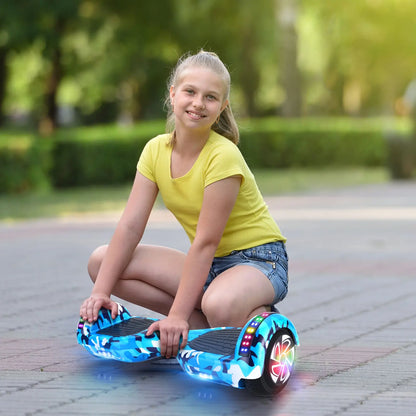 Photo of a young girl sitting next to her RIDEO Hoverboard in Blue Galaxy, highlighting the hoverboard’s appeal to children and teens