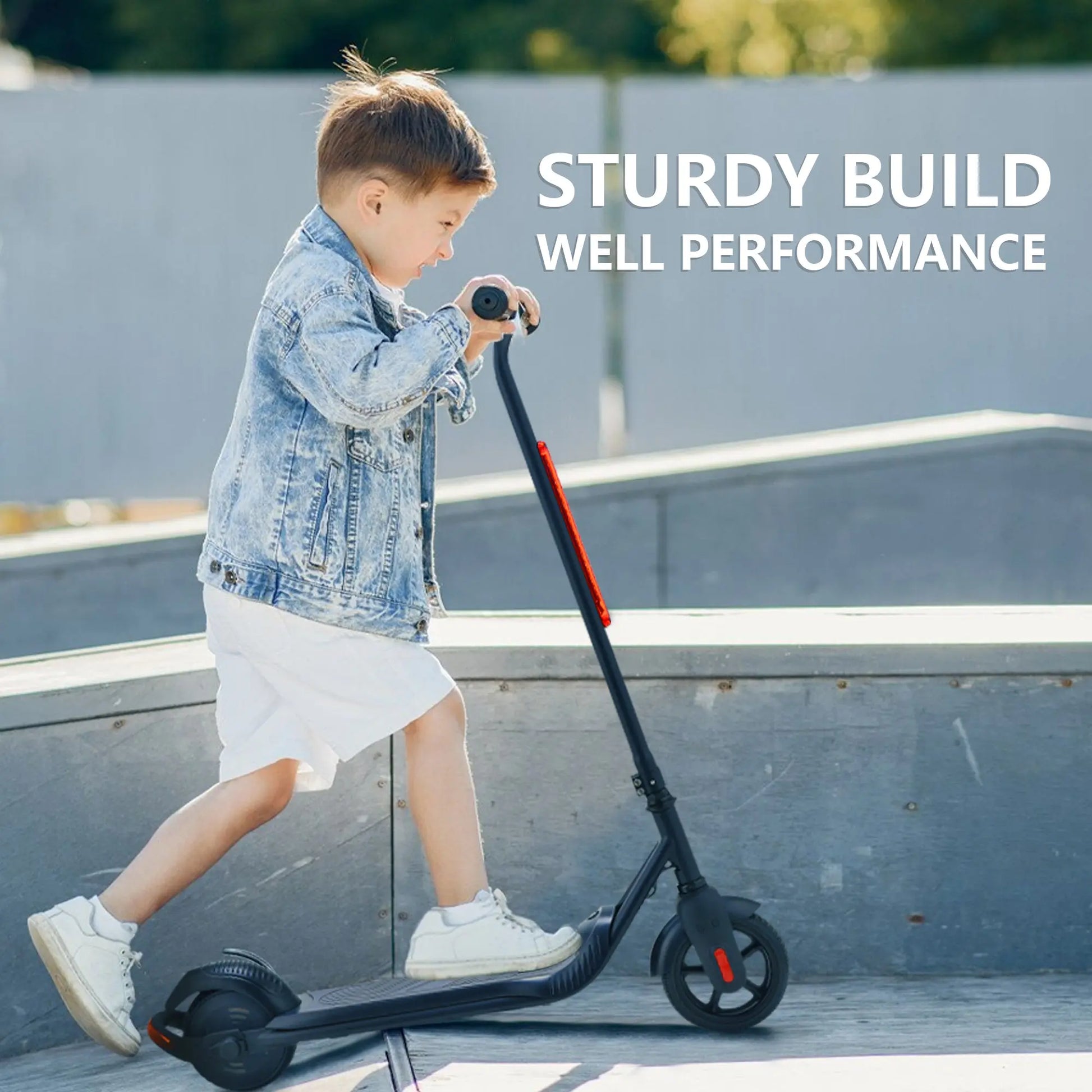 Image of a young boy using a BLACK electric scooter in an outdoor skate park, wearing casual clothing and focusing on the sturdy build.