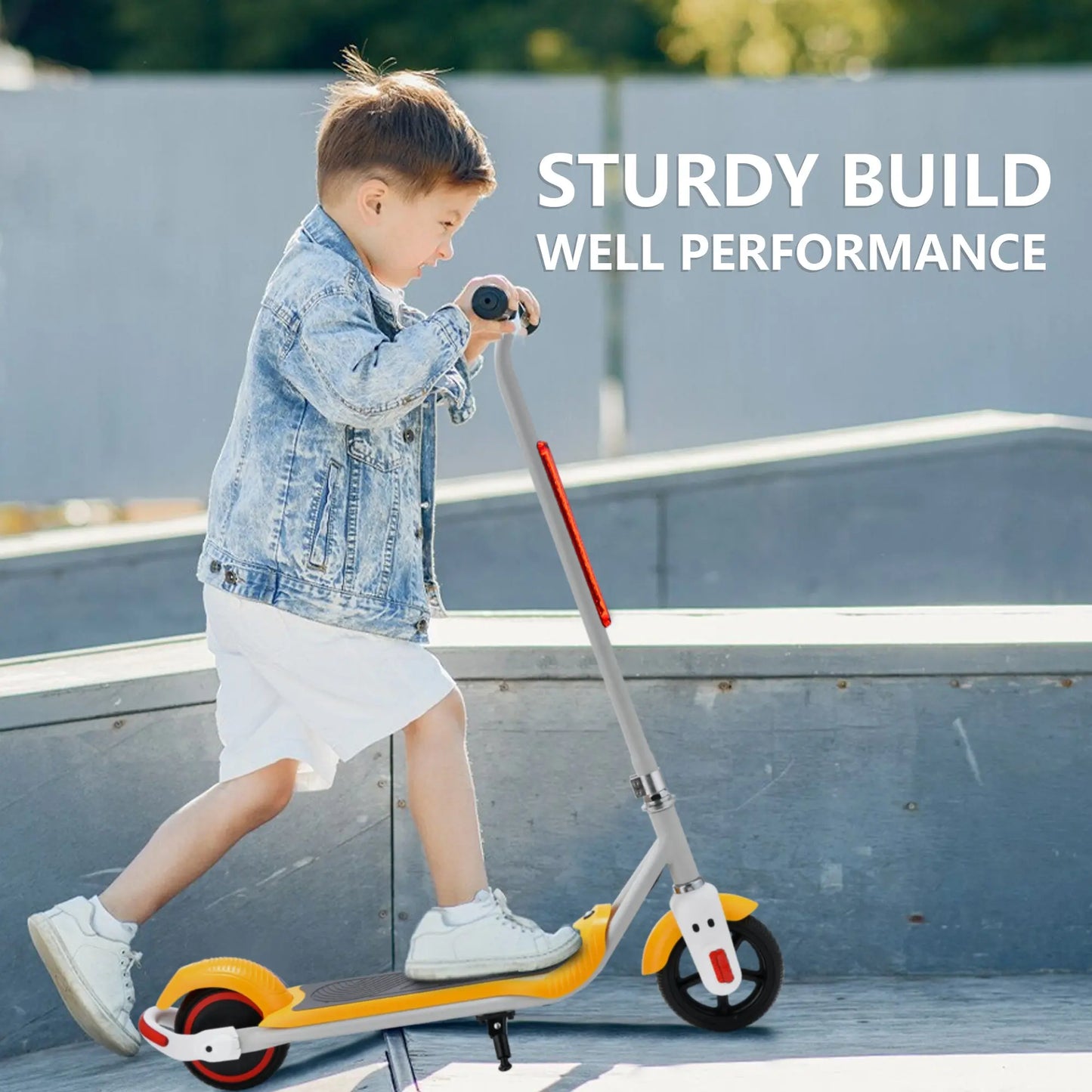 Image of a young boy using a yellow and white electric scooter in an outdoor skate park, wearing casual clothing and focusing on the sturdy build.