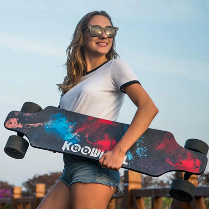 Woman Holding Skateboard: Image of a woman holding the Koowheel Electric Skateboard, showcasing a vibrant and colorful board design.